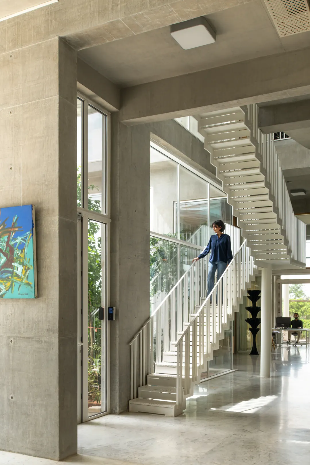 A painting beside the stair at Oxygen, the studio beyond.