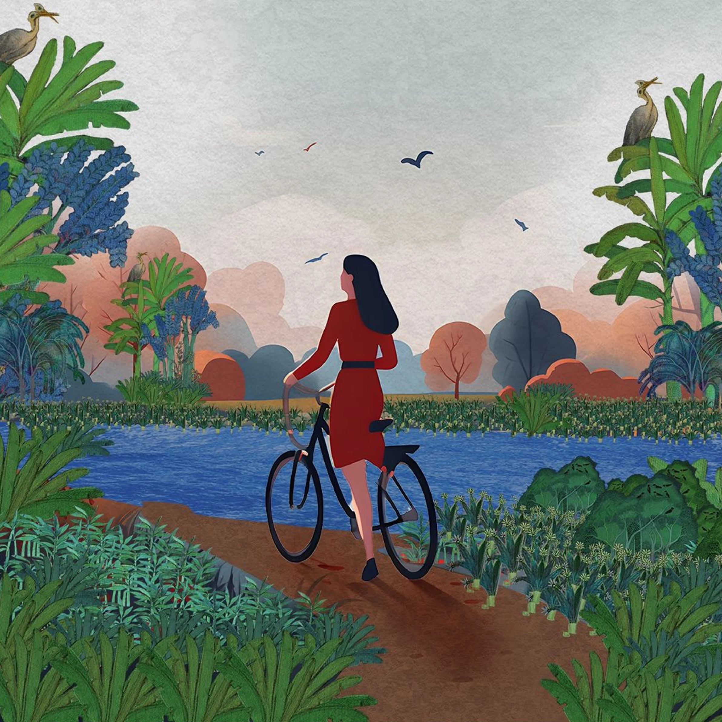 A woman in a red dress walks her bicycle along a red earth path by the water, under a pale sky with birds and blush coloured trees